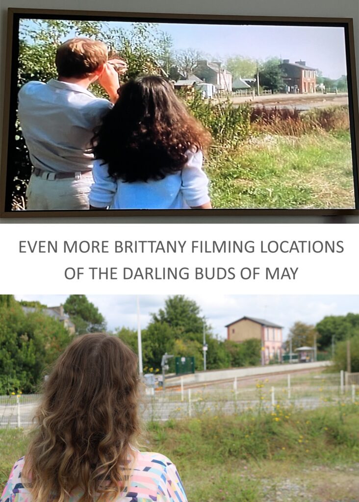 A split image showing a scene from the TV show 'The Darling Buds of May' on a screen, depicting two characters observing a location. Below is a person with long hair, standing in front of a train station, looking towards the tracks and surroundings, capturing the contrast between the past filming location and the current view.